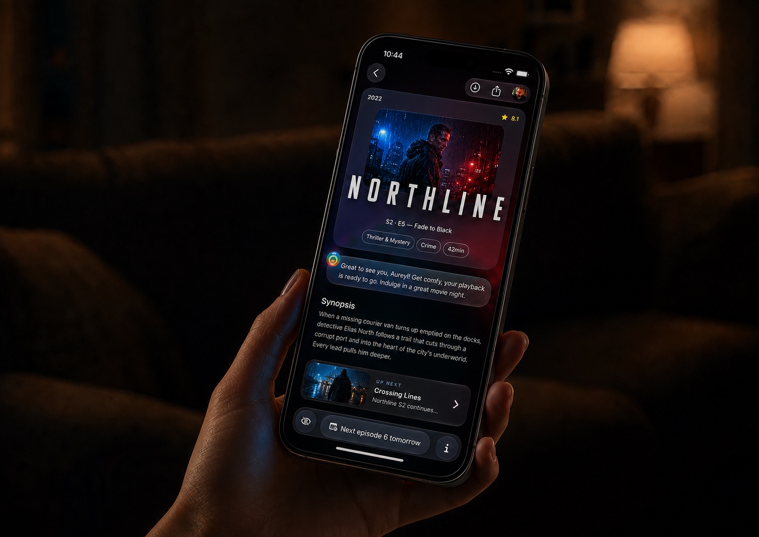 Ōreia showing Northline on an iPhone held in a softly lit living room